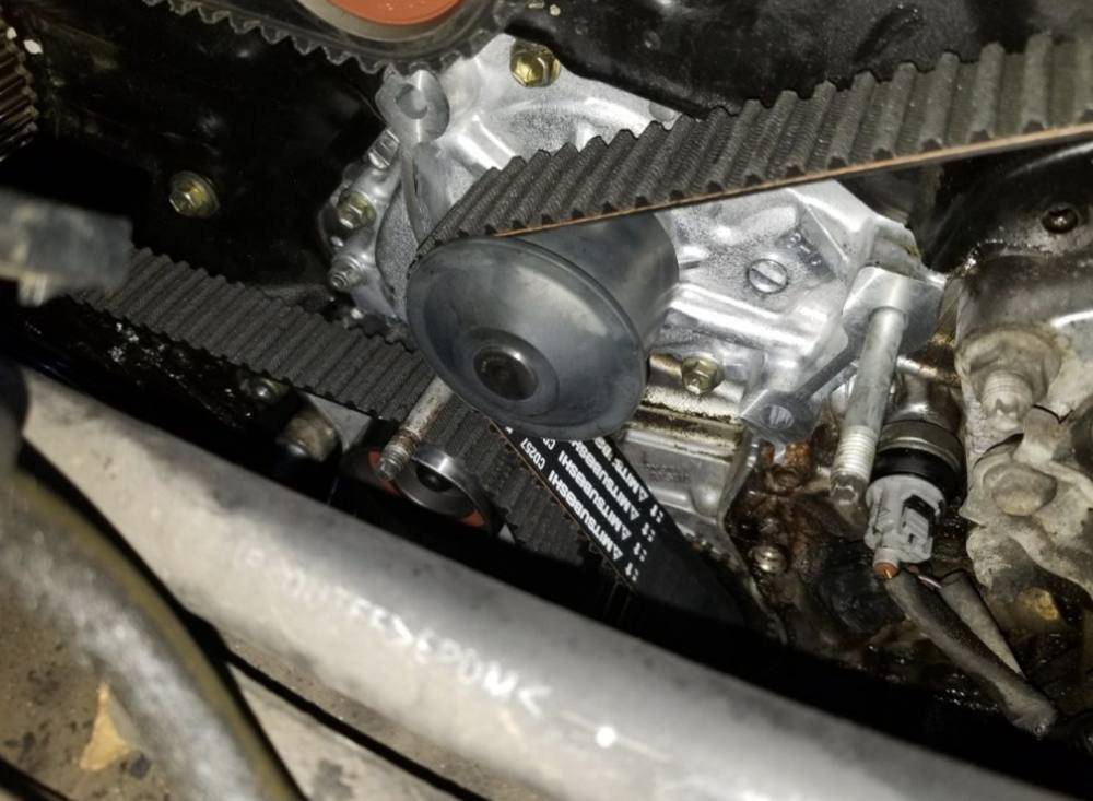 New water pump installed during a timing belt job